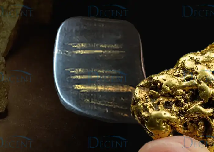 Gold nugget and touchstone highlight Qingdao Decent Group’s fire assay solutions for accurate gold purity testing.