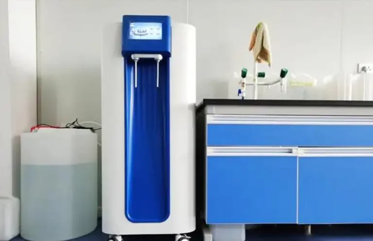 A modern pure water purification system from Qingdao Decent Group in a laboratory setting, next to a lab bench with blue cabinets.