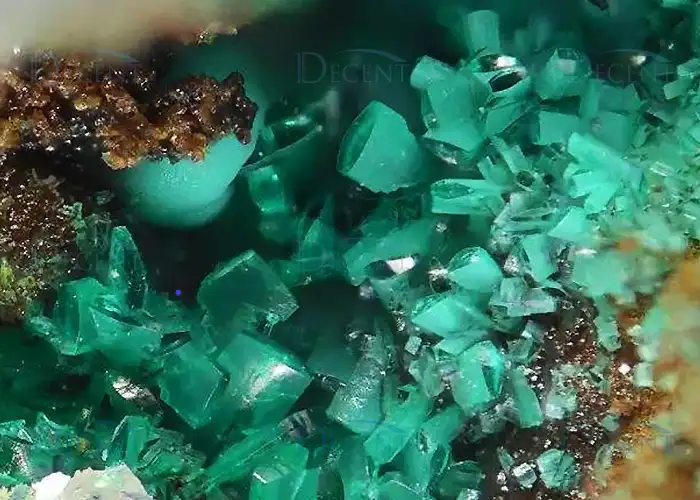 Metallic ore sample and fire assay crucibles highlight Qingdao Decent Group’s precision solutions for precious/base metal analysis.