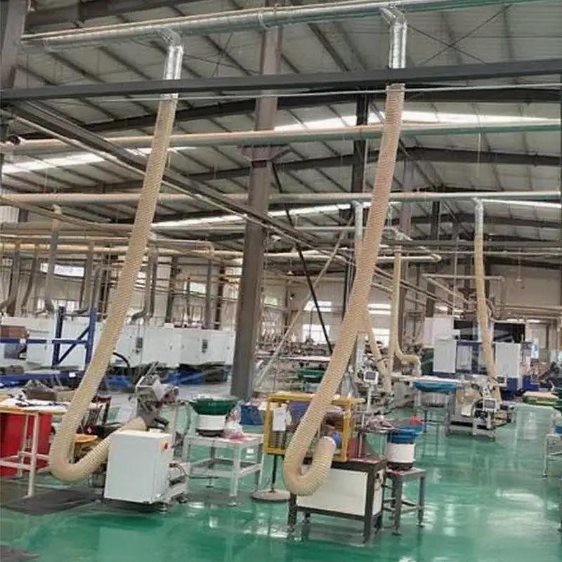 Close-up of DECENT external factory dedusting system ductwork and blue collection unit by Qingdao Decent Group