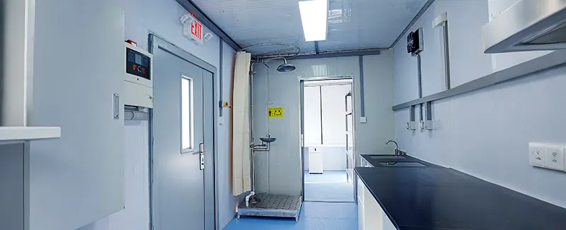 Emergency safety shower and eyewash station in a clean laboratory environment, highlighting DECENT's commitment to safety