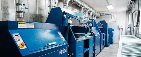Interior view of a DECENT mobile containerized lab, showcasing blue analytical machinery, integrated ventilation systems, and an optimized layout for efficient space utilization.