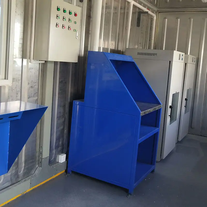 Interior of a DECENT modular laboratory unit, featuring a blue workstation, electrical control panel, and specialized white equipment.