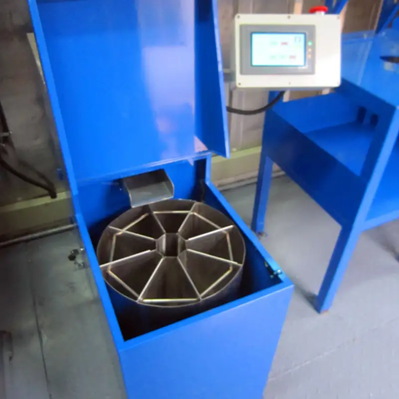 A top-down view of the opened rotary sample divider, showing the metal compartments for splitting mineral samples.