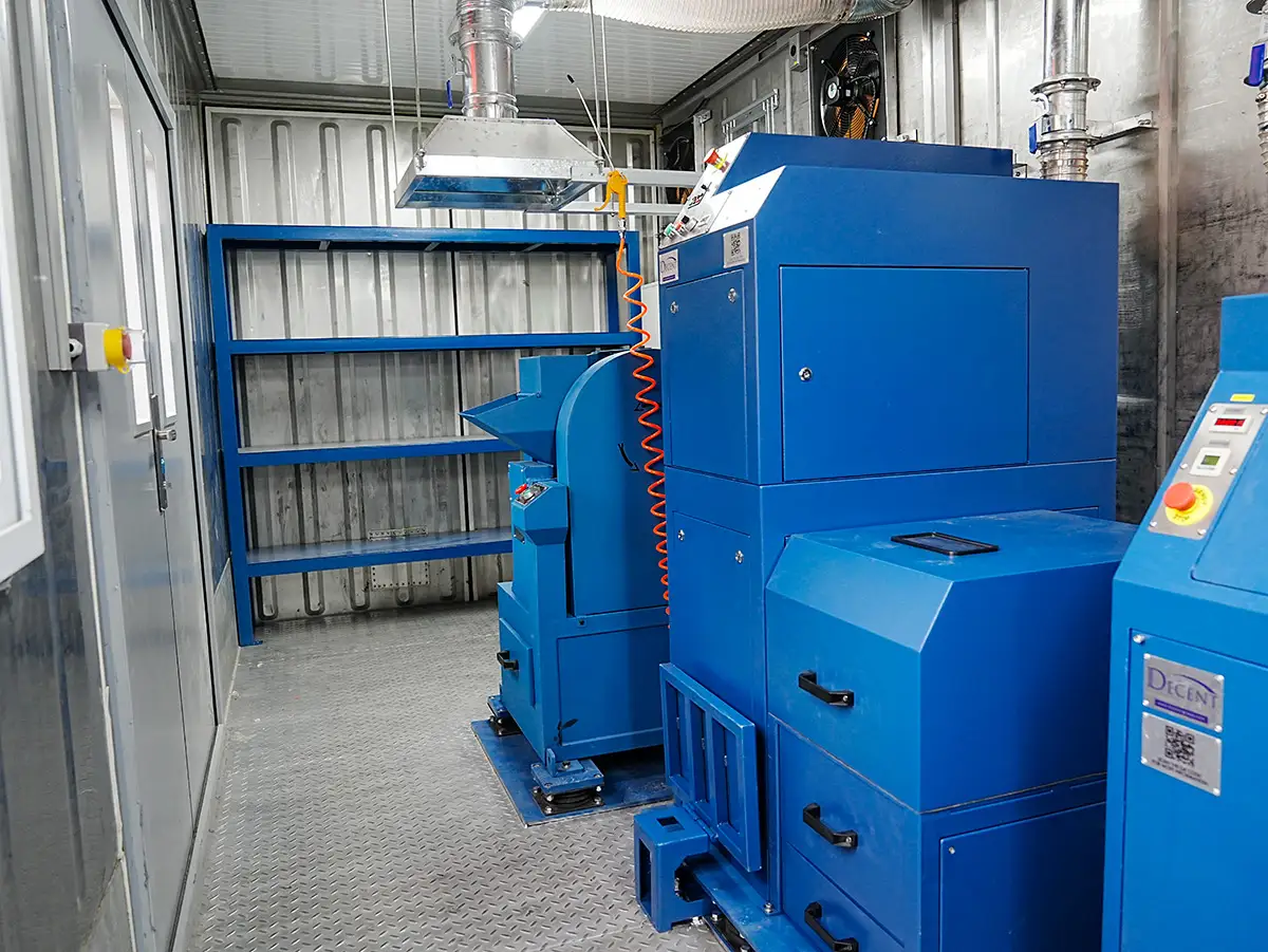 DECENT sample preparation laboratory interior with blue industrial machinery, Qingdao Decent Group, mining and metallurgy equipment.