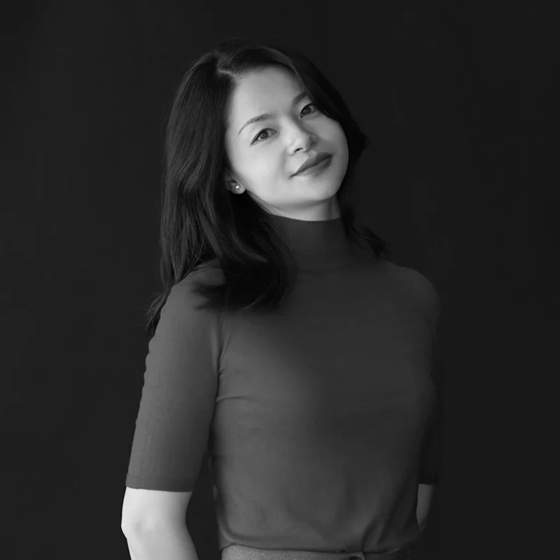 Black and white portrait of Esther Chen, VP of Global Sales at DECENT, smiling softly.