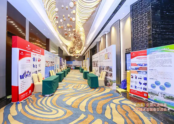 Exhibition hall for the 6th National Conference on Fire Metallurgy, showing booths and posters from Qingdao Mars Laboratory Technology Co., Ltd. and other participants.