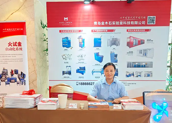 Qingdao Mars Labtech (DECENT Group) representative at 2025 International Gold Industry Development Conference booth, showcasing lab equipment.