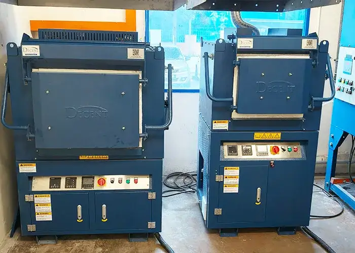 Two blue DECENT fire assay furnaces installed in a laboratory, representing Qingdao Decent Group's custom fire assay solution for precious metals analysis in Singapore.