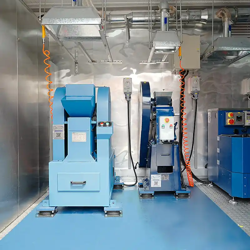 A light blue DECENT Jaw Crusher and other sample preparation equipment inside Qingdao Decent Group's containerized laboratory for Côte d'Ivoire.